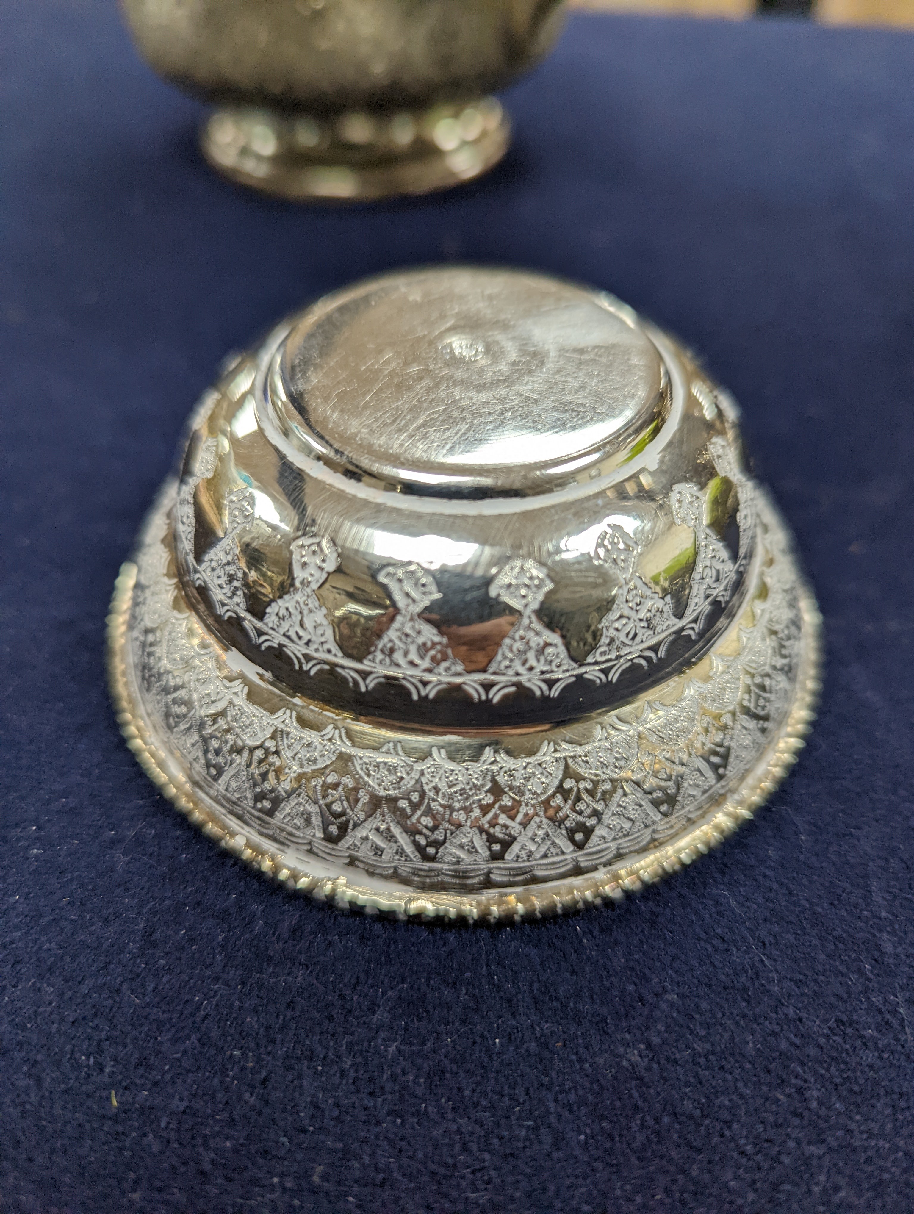 A set of six Persian embossed 84 standard white metal coffee cup holders and matching sugar bowl and cover by Vartan and four other Persian white metal items.